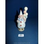 A Lladro figure Nos. 5811, 'clown carrying coloured balloons'.