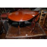 A reproduction cross-banded Mahogany dropleaf swing-leg Occasional Table,