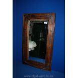 A rectangular Mirror with wooden surround