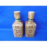 A PAIR OF COVERED DECANTERS