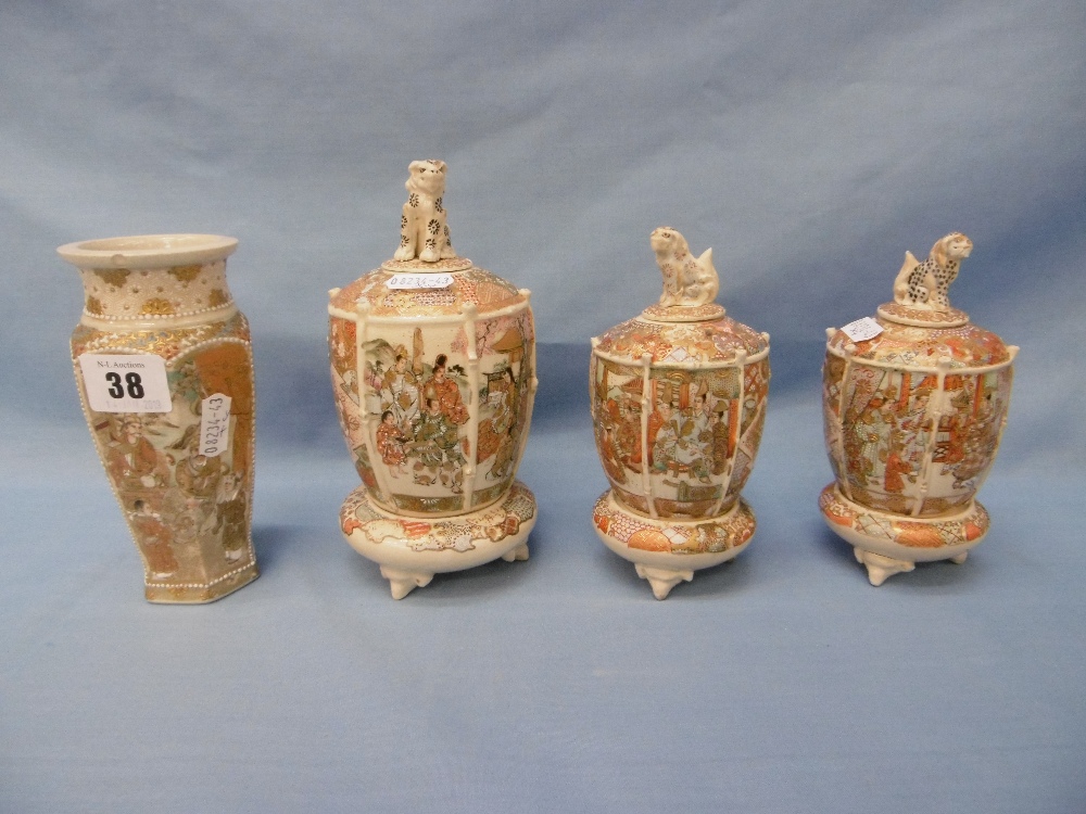 A collection of four Japanese miniature Satsuma vases on stands