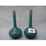 A pair of oriental bud vases, 14.5cms approx.