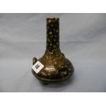 A Chinese glazed vase on tripod feet, with three handles, marked to base,