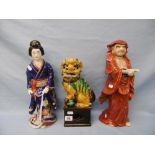 Three pottery incense burners comprising of a Geisha, Immortal and a dog of fo, 36 cms high approx.