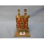 A Judaica scroll in brass holder