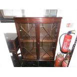 A mahogany glazed dwarf bookcase