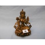 A brass 19th century Buddha, 15 cms high approx.