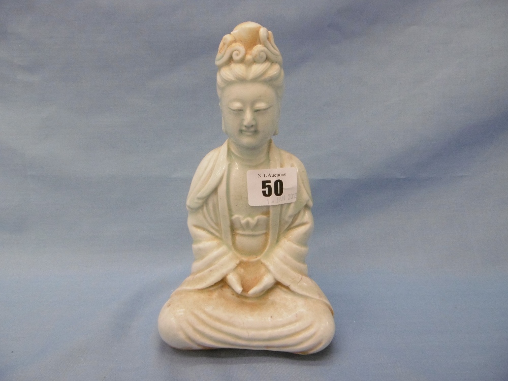 A Chinese 'Song style' porcelain figure of Quan Yin, 20cms high, a.