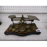 An ornate set of early 20th century brass postal scales