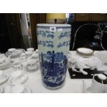 A BLUE AND WHITE ORIENTAL PORCELAIN UMBRELLA STAND