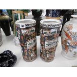 A pair of cylindrical Imari style vases