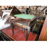 An Edwardian mahogany envelope card table