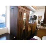 AN EDWARDIAN WALNUT SINGLE WARDROBE