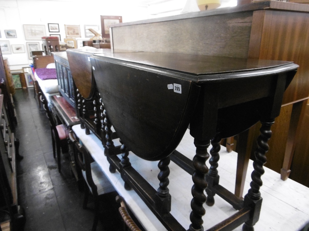 AN OAK BARLEY TWIST GATELEG TABLE