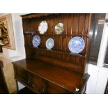 AN OAK DRESSER (CIRCA 1920) STAMPED MAPLES ON BACK, 152X190CM APPROX.