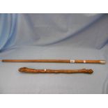 A silver topped cane and Shilalee