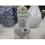 A Chinese 'Song style' porcelain figure of Quan Yin, 20cms high, a.