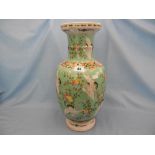 An oriental green vase decorated with storks & blossoming fruit A/F