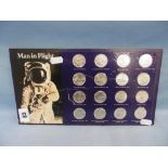 Sixteen "man in flight" coins