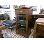 An Edwardian mahogany music cabinet