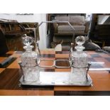 A silver plated four division tantalise (only two decanters)
