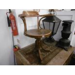 A bent wood revolving armchair