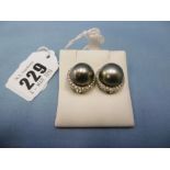 A pair of Tahitian pearl and diamond earrings (13.