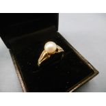 14ct gold and pearl set solitaire ring,