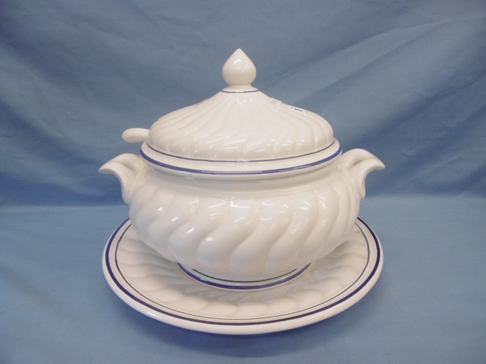 A large ceramic soup tureen