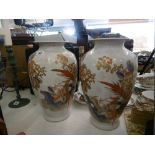 A pair of orange & white vases