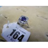 A white metal marked 18ct art deco style sapphire and diamond ring,