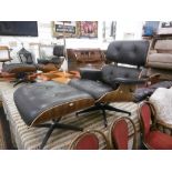 An Eames style walnut and leather lounge chair and stool A/F