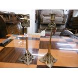 A pair of art nouveau candle sticks