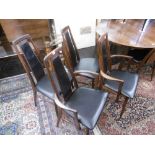 A set of eight plus two carvers Danish mid century "Eva" rosewood upholstered dining chairs by "
