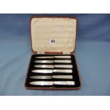 A boxed set of art deco mother of pearl handled silver bladed fruit knives,
