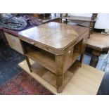 An art deco centre table, with two brush slides 60cm x 60cm x 60cm, chips to some parts veneer,