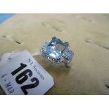 An 18ct white gold aquamarine and diamond ring, aquamarine 7ct,