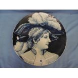 A 19th Century Fischer & Mieg blue and white plaque decorated with a lady with a plume
