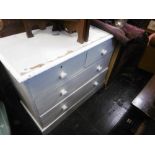 A pine two over two chest of drawers