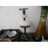 A 19th century oil lamp set with limoges plaques