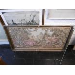 A gilt framed tapestry