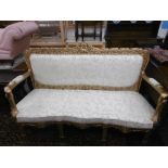 A GILT THREE SEATER SALON SOFA