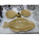 A four place setting Shorter yellow pottery fish set, side plates,