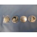 Four silver proof coins
