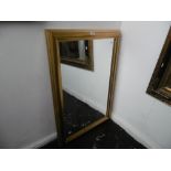 A gilt framed mirror