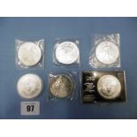 Five silver proof dollars and one other