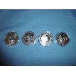 Four silver proof coins
