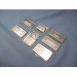 Seven silver ingots,