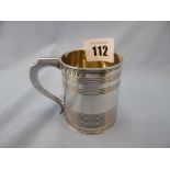 A small George III period hallmarked silver mug with cylindrical reeded body,