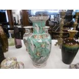 An oriental green vase decorated with storks & blossoming fruit A/F